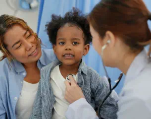 doctor checking a child's heart