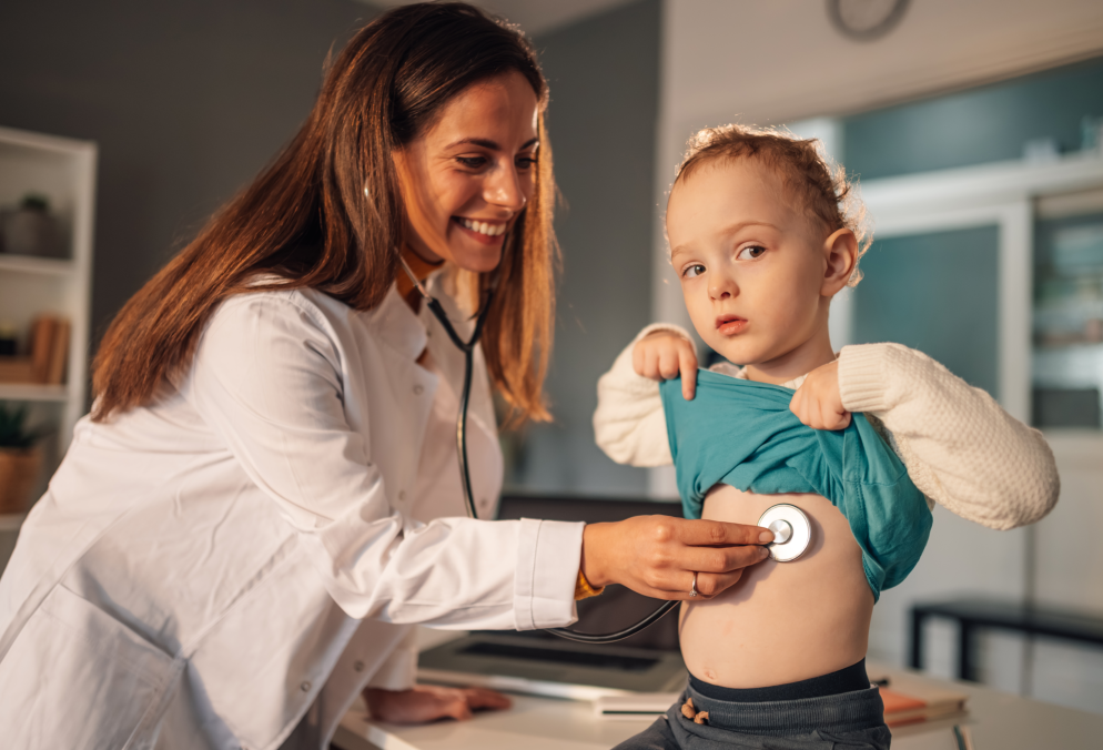 woman checking a child's heart